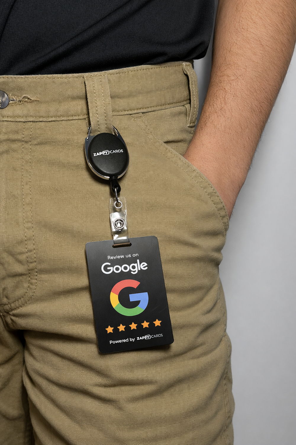 Service technicians in matching work shirts, each wearing a ZappyCard Google review badge on the job site